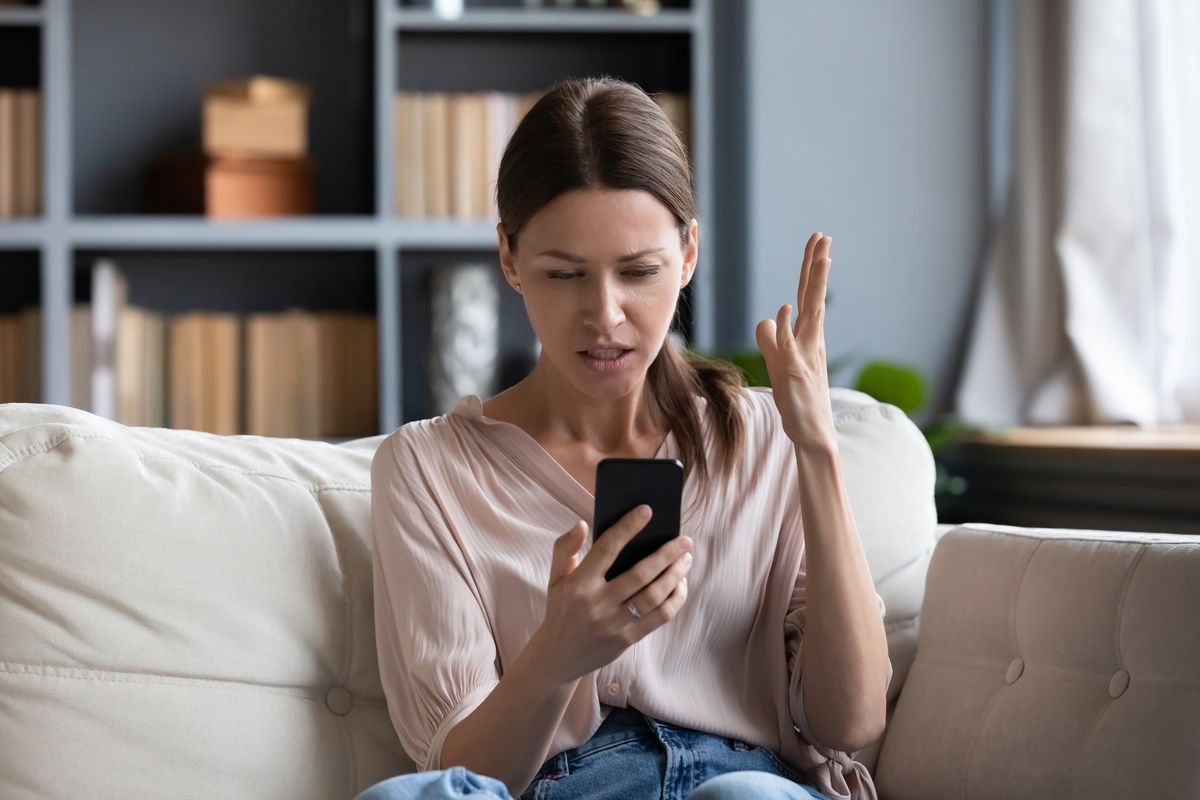 Confused angry young woman having problem with phone
google