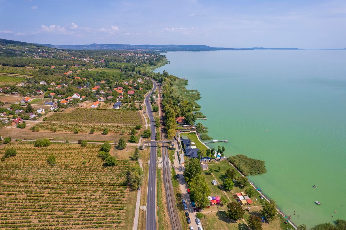 Aerial view of Lake Balaton, road, houses, fields and gardens in Hungary